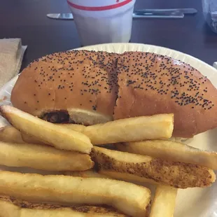 a sandwich and fries on a paper plate