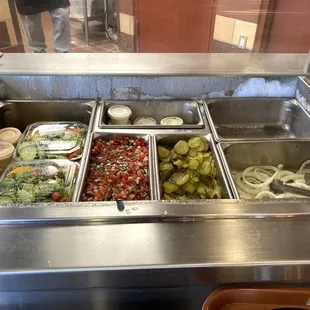 Salsa, Pickles, Salad, and Onions.