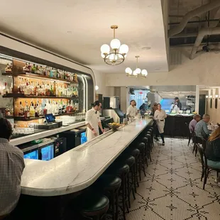people sitting at the bar