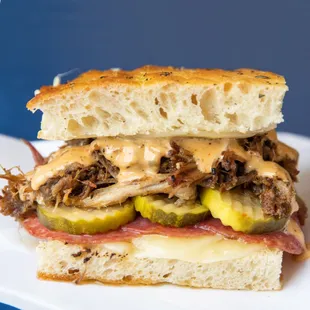 El Lechón--Roasted pork shoulder, unsmoked provolone, spicy pickles, mojo mayo, brown mustard, genoa salami, rosemary focaccia