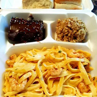 Seafood fettuccine with ride dressing, them doughs, and cake cake