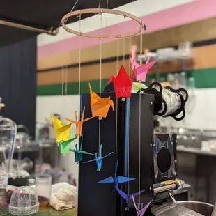 origami cranes hanging from the ceiling
