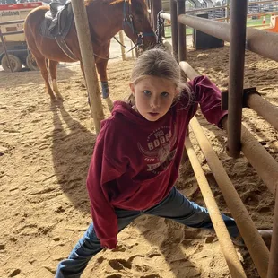 Little sister waits patiently, and enjoys watching the lesson.