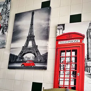 a red telephone booth and a red bus