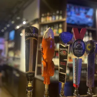 a row of beer taps