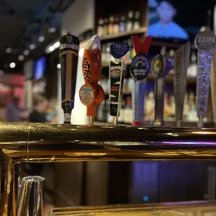 a row of beer taps