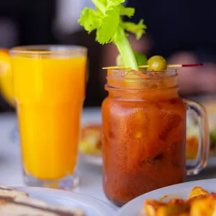 a glass of juice and a plate of food