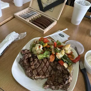 Custom cutlery and beautiful char marks embellish the immaculate marbling