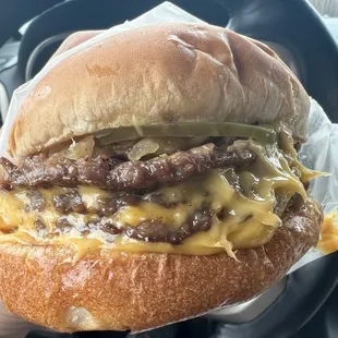 Triple Cheeseburger, with mustard, pickle, grilled onions, salt+pepper!!! Still one of the best burgers I&apos;ve ever had.