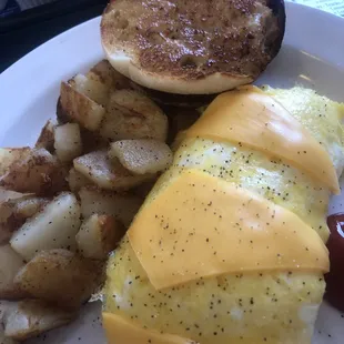 an omelet and potatoes on a plate