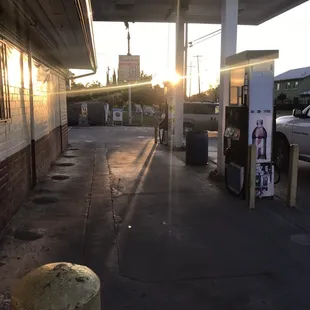 a gas station at sunset