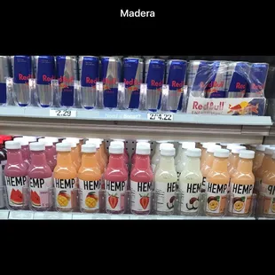 a shelf of juices and drinks