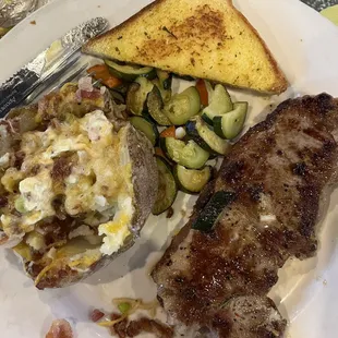 April NY steak special with loaded baked potato.