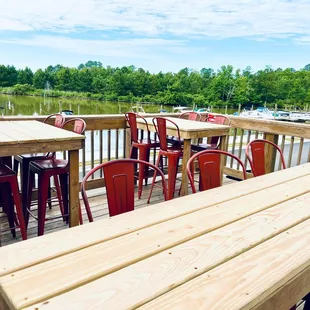Our Deck overlooking the water has some of the best seats on our 10 acres!  We renovated the tables in June 2022.