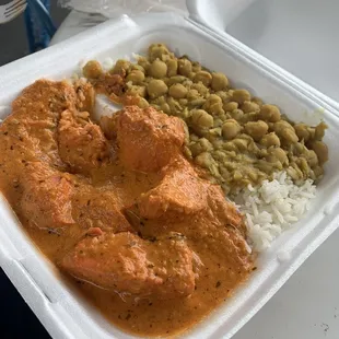 Chicken tikka masala with a side of rice and chickpeas