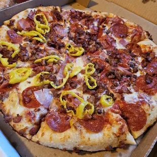 Meat Pizza with pepper rings on half
