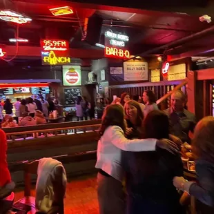 a crowd of people at a bar