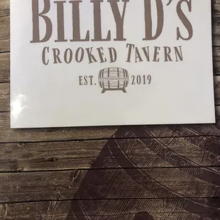a sign for billy d's crooked tavern