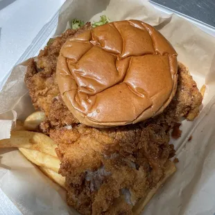 Large pork sandwich with fries