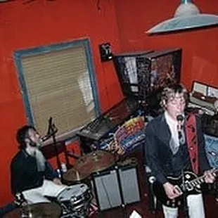 a band playing in a recording studio