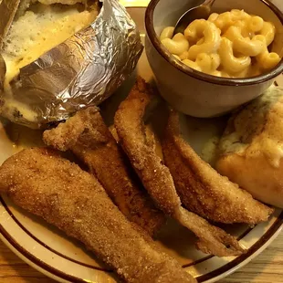 a plate of food and a bowl of macaroni and cheese