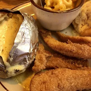a plate of food and a bowl of macaroni and cheese