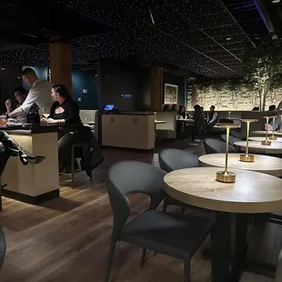 people sitting at tables in a restaurant