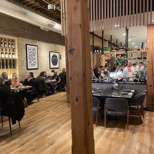 a restaurant with people sitting at tables
