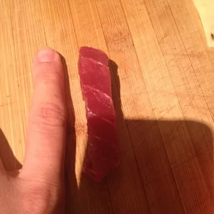 And this is a piece of tuna sashimi!!!! Smaller then my index finger!!! P.s.  I am very petite !!!!!