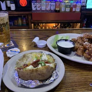 Loaded baked potatoe - ala carte, oriental boneless wings.  Yummy