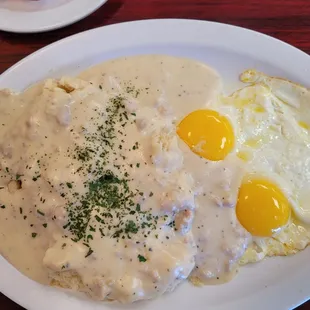 Sausages and Gravy biscuits and two over easy eggs. A la cart plate