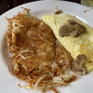 Mushroom onion omelette comes with hash browns and toast