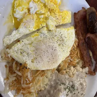 3 eggs over medium, sausage, thick crispy bacon, hash browns and a biscuit with sausage gravy.