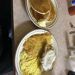 Chicken fried steak, scrambled eggs and pancakes