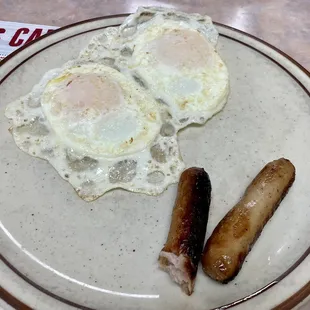 Eggs over easy with sausage links (I was hungry and took a bite first!)
