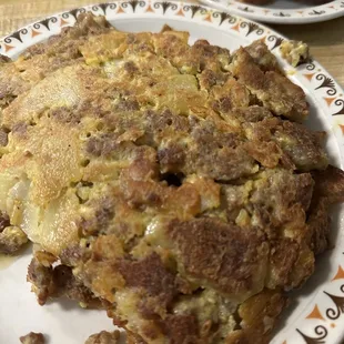 Sausage, cheese with home fries inside. Big!