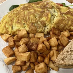 Greek Omelette, potatoes and toast. Ask for easy eggs and sour cream on the side. It was really good.