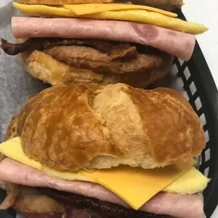 Triple meat croissant sandwich ( sausage; ham; bacon; egg and cheese)