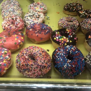 a variety of sprinkled donuts