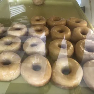 a display of glazed donuts