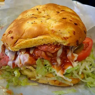 Super Roast Beef with cheese, add lettuce, tomato, pickles, sauce, and horseradish. Super messy but super big and delicious!!