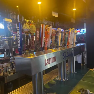 a row of beer taps