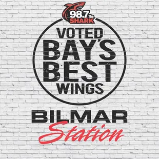 a brick wall with the words voted bays best wings