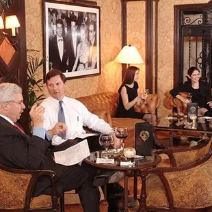 a group of people sitting around a table