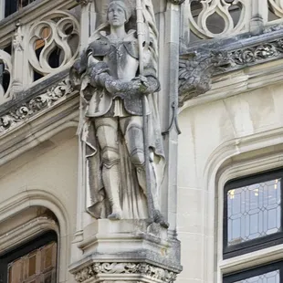 Statue on the side of the house