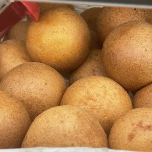 a basket of baked potatoes