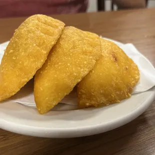 three pieces of fried food on a plate