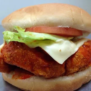 a chicken sandwich with lettuce and tomato