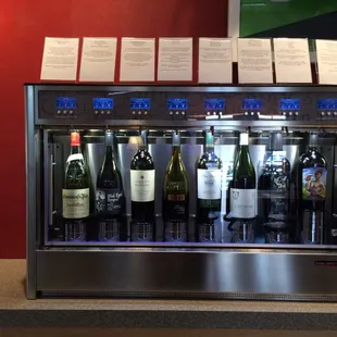 Fancy wine dispenser. Choose small, medium, or large. It shows the price per pour.