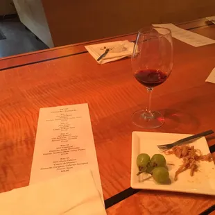 a glass of wine and a plate of food